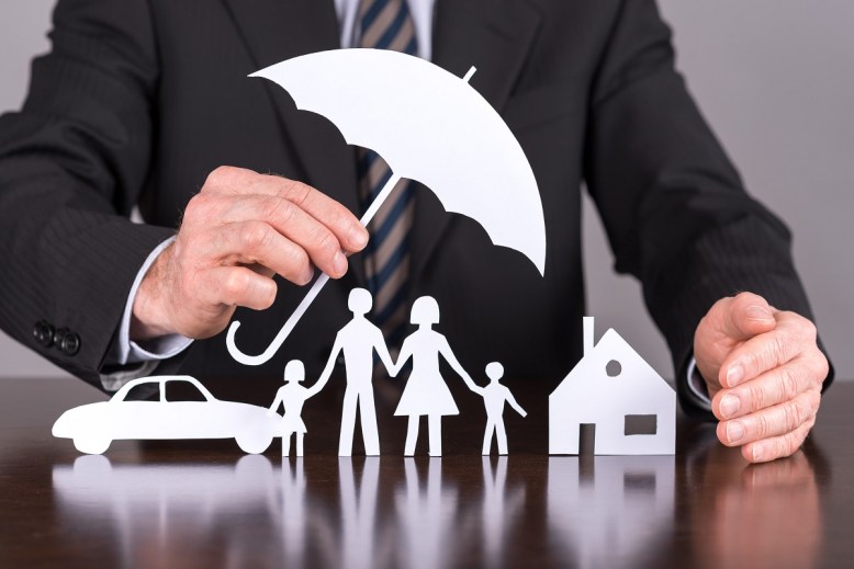 Insurance Pic Man with Umbrella and Family
